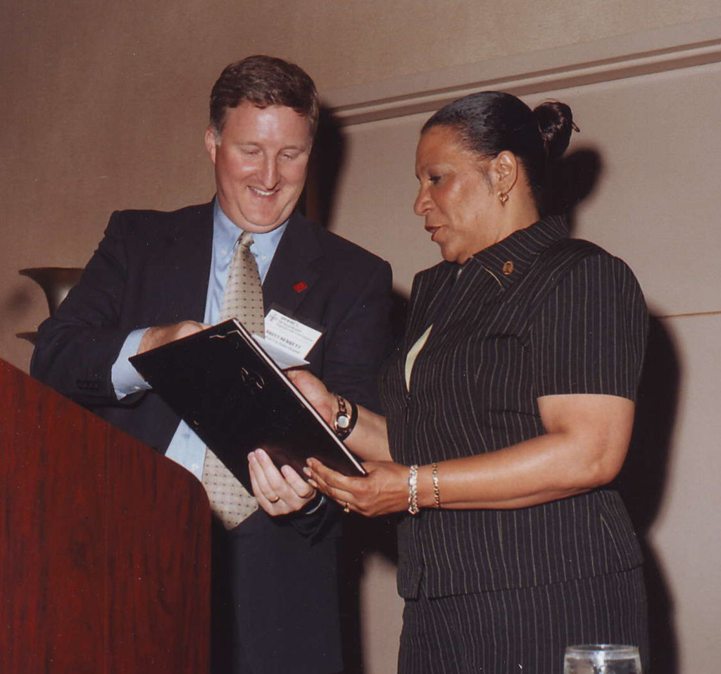 Medical City Dallas' CEO Britt Berrett (left) presents Maria Theresa Thornton her award.